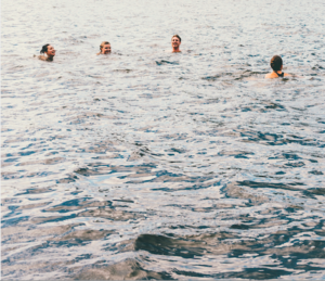 People swimming in a lake.